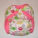AI2 cloth diaper cover made from Pink Ooga Fabric fabric