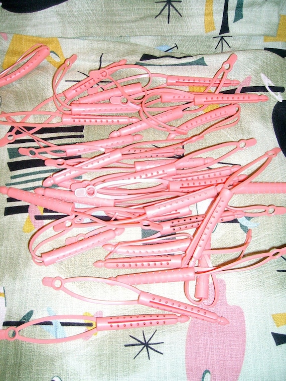 Vintage pink rubber curlers
