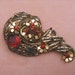 Vintage Open Metalwork and Ruby Red Rhinestone Fur Clip