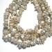 Keishi petal flat pearls ivory white 7in strand