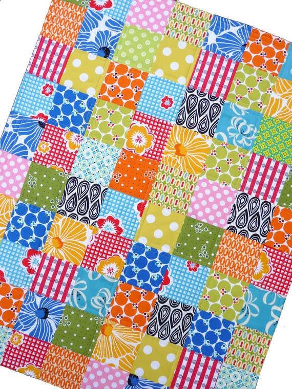 Colorful Patchwork Quilt with a Splash of Pink by Red