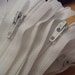 Fifty white 12 inch YKK zippers