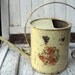 Vintage watering can display only floral decal on cream