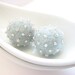 Set of 2 light sky blue round wool beads decorated with seed beads