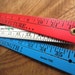 Vintage Tools Old Red Wood Level and Red White and Blue Folding Yard Stick Bank Ruler