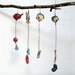 Friends -------- Ceramic Miniature on String.