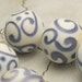 SRA Handmade Lampwork Bead Set of 7, Round Ivory Beads with Lavender Scrolls, Pomander