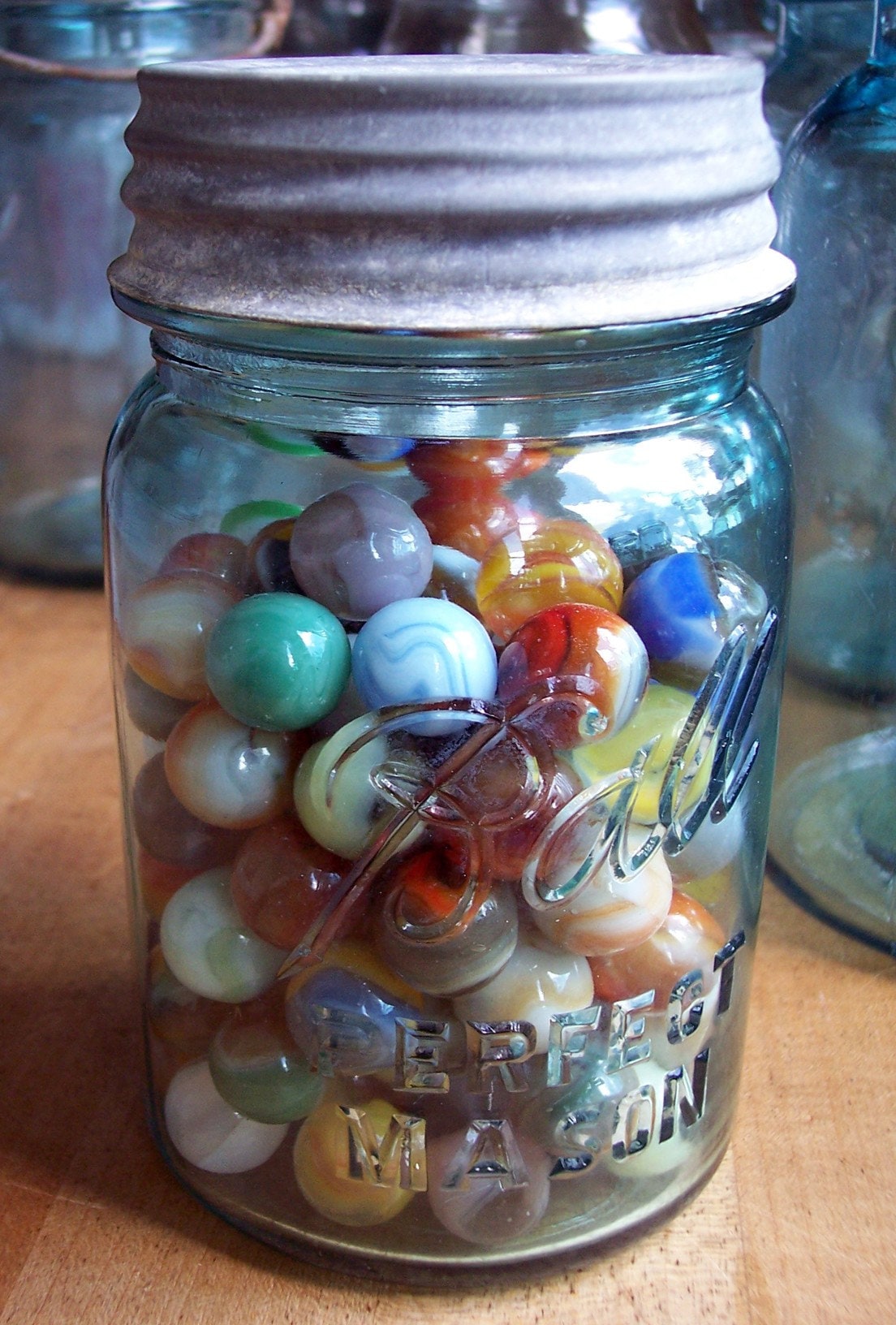 Marbles in a Blue Pint Ball Jar with a Zinc Lid