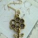 HONEYCOMB with BEE (moves) - Gold Plated Charm