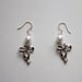 White beaded bow dangle earrings