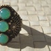 Exotic filigree and green stone cocktail ring--silver and gold wash