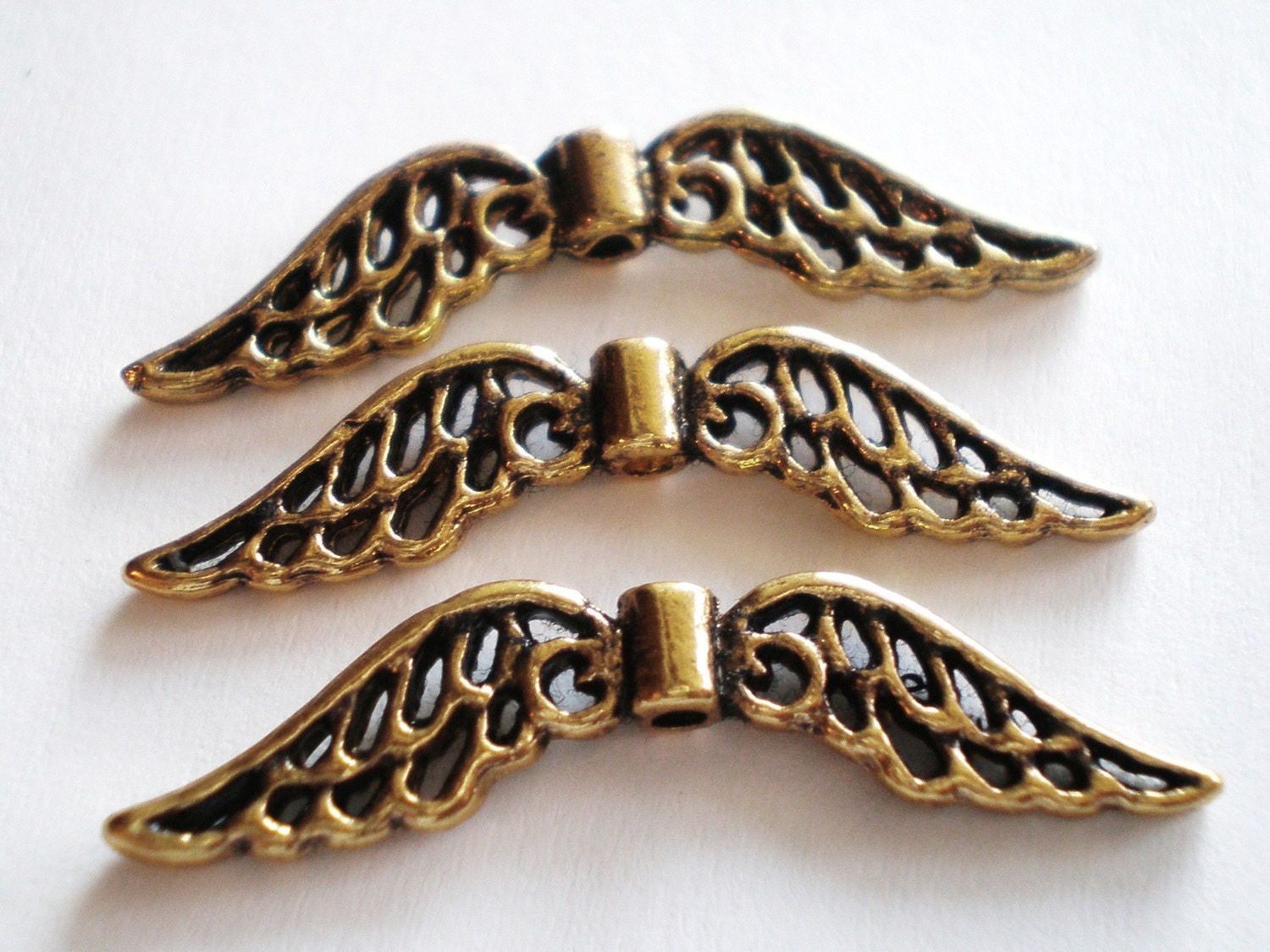 Angel wing charms 12 antique gold beads metal by GatheringSplendor