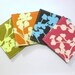 Set of 4 Coasters made w/ Designer Fabric Coriander one each of Clay Pink Pine and Olive