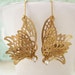 Butterfly In Motion, vintage inspired brass butterfly charm earrings