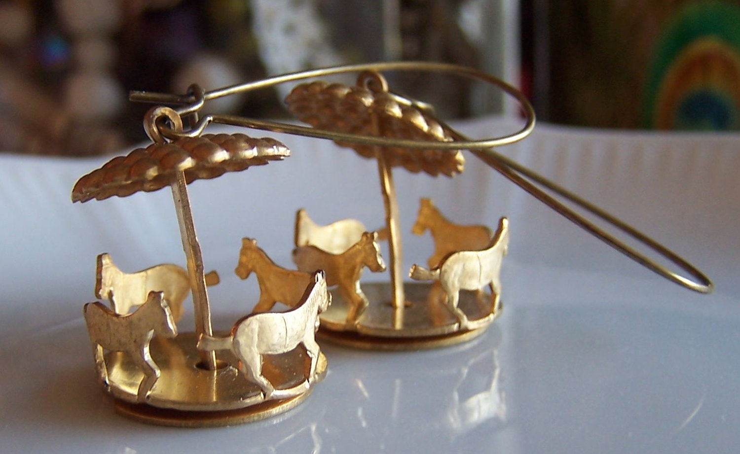 spinning carousel earrings