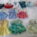 Bag of doll clothes and shoes
