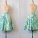 vintage 1950s skirt / vintage 50s skirt / vintage novelty print green wrap skirt