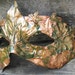 Copper Greenman leaf mask with green ivy leaves