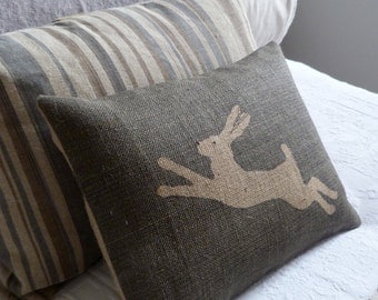hand printed and stitched charcoal leaping hare cushion