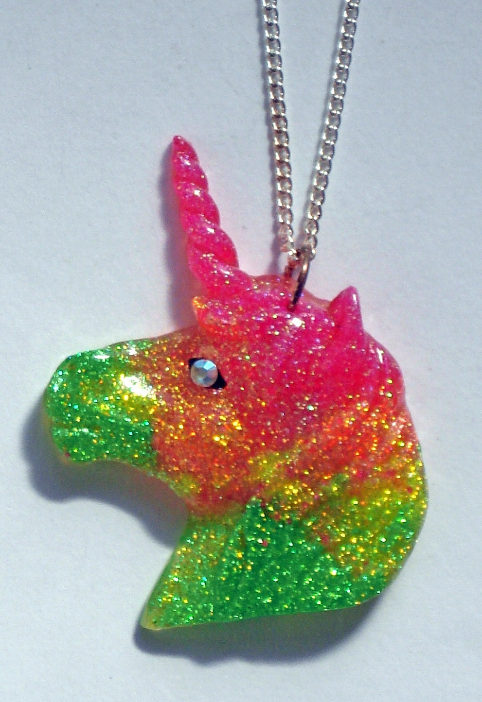 Multi-colored glitter UV glow unicorn head by ToxicGlamour on Etsy