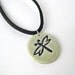 Round porcelain pendant with dragonfly impression