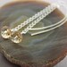 Sterling silver dangle earrings with champagne sparkly Swarovski crystals on chain and long hookone wrapped stones