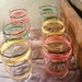 SALE. set of 6 vintage glasses. 4.5 inches tall. painted pastel stripes with gold. gorgeous shades of pink, green and yellow.