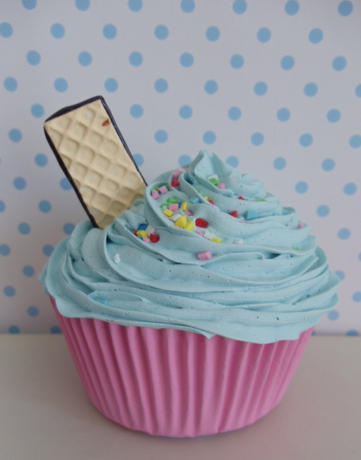 Sweet Cupcake With Light Blue Frosting With Colorful Candies 