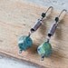 Copper earrings - copper coil dangle earrings with green faceted Picasso Czech glass beads - copper wirework earrings