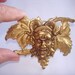 Vintage Jewelry Baccus in the Grape Vines Brooch Gold Tone Repousse Ruby Rhinestones