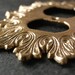 Vintage Regency Brass Electrical Outlet Plate with Fleur de lis Design.