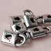 10 Pcs. Little Master Key Plastic Pendant (Silver Coted) 10 mm.