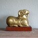 vintage large brass ram on wood