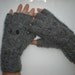 Hand-knitted women grey color fingerless gloves with knitted owl