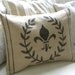 Burlap laurel wreath and fleur de lis pillow cover
