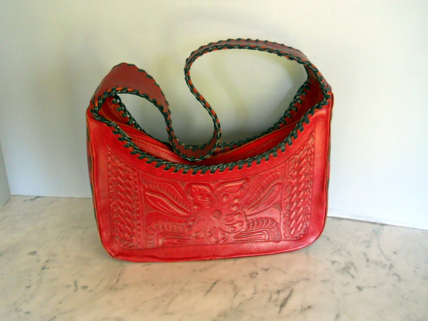 red tooled leather purse