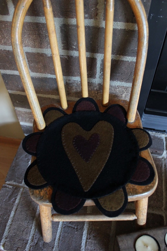 Primitive heart wool penny rug