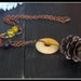 Samhain. Rustic Metal Pine Cone and Gemstone Speckled Necklace