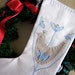 A Christmas stocking in Scandinavian style with applique felt bird