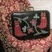 Two Cats on a Green Suitcase