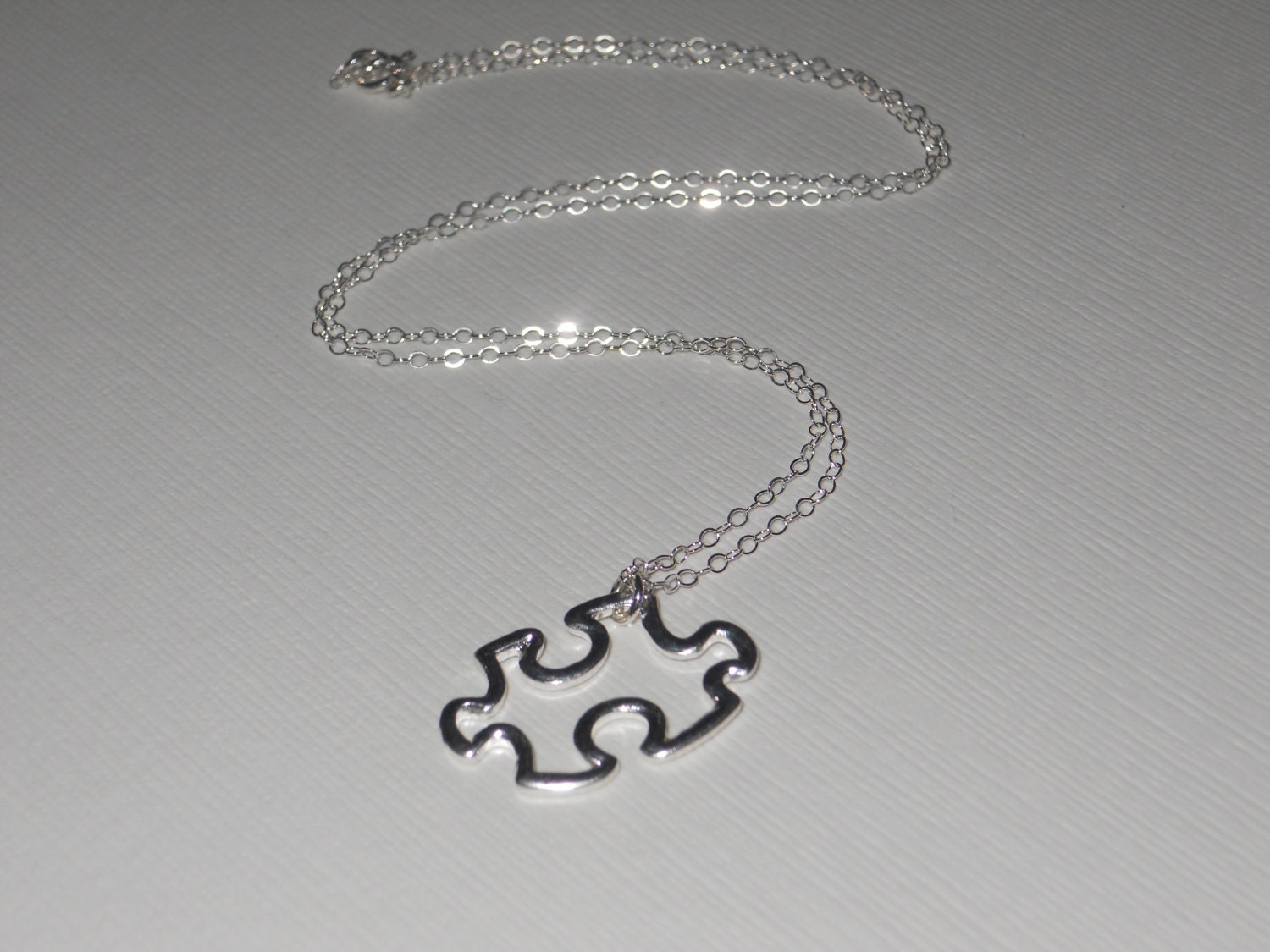 Puzzle Piece Necklace by thelovelyraindrop on Etsy