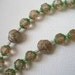 Light pink Catholic rosary - Might be rosebuds