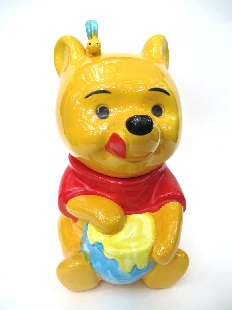 winnie the pooh stuffed animal with honey pot