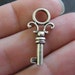 6 Key charms ( double sided and 3D ) 26 x 12mm antique silver tone ( FREE combined shipping )