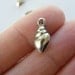 10 Shell charms 16 x 6mm antique silver tone ( FREE combined shipping )