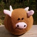 Clover the Cow Squeez-a-ball plush ball toy