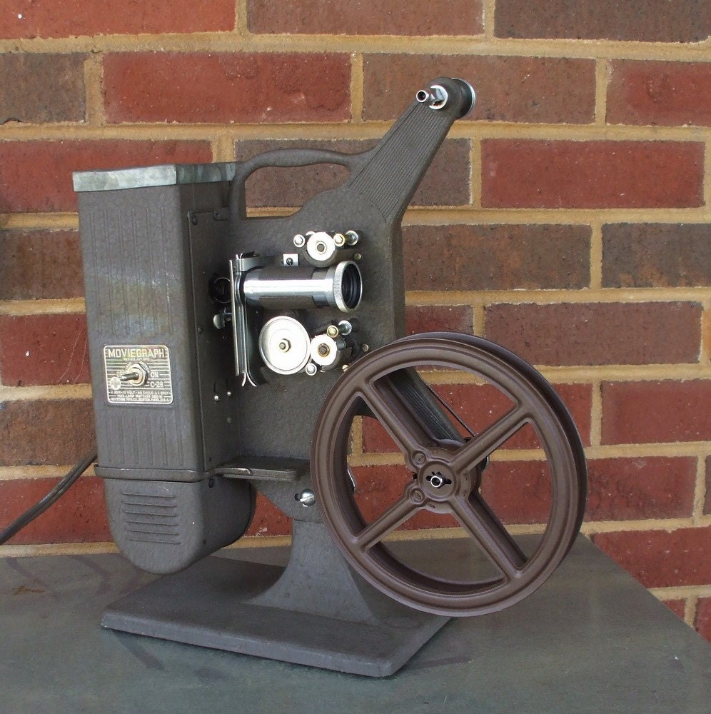 keystone moviegraph 16mm projector with reel model c28