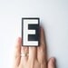 vintage letter E enamel sign metal hanging black & white text type font