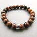 Mens chunky burnt horn and robles wooden beaded stretch bracelet with silver plated infinity bead