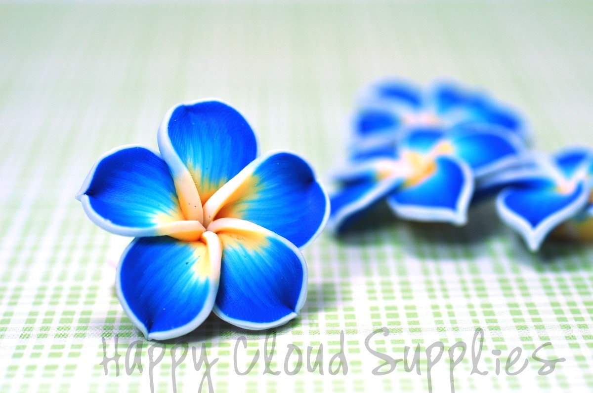 polymer clay plumeria frangipani flower beads in blue white polymer clay plumeria frangipani flower beads in blue white